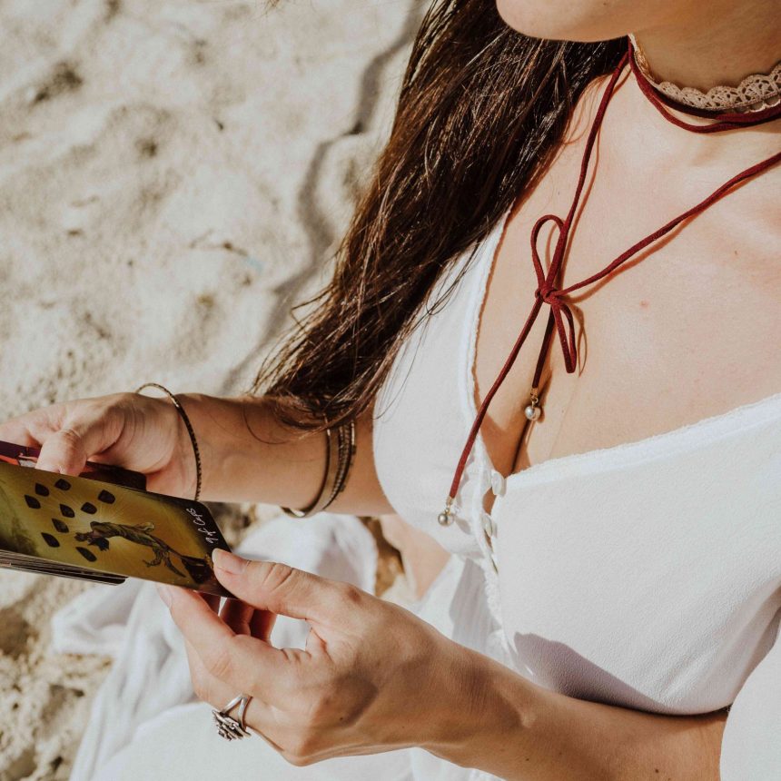 Rose, a spiritual coach and psychic, is looking cards she has pulled during an intuitive psychic reading.