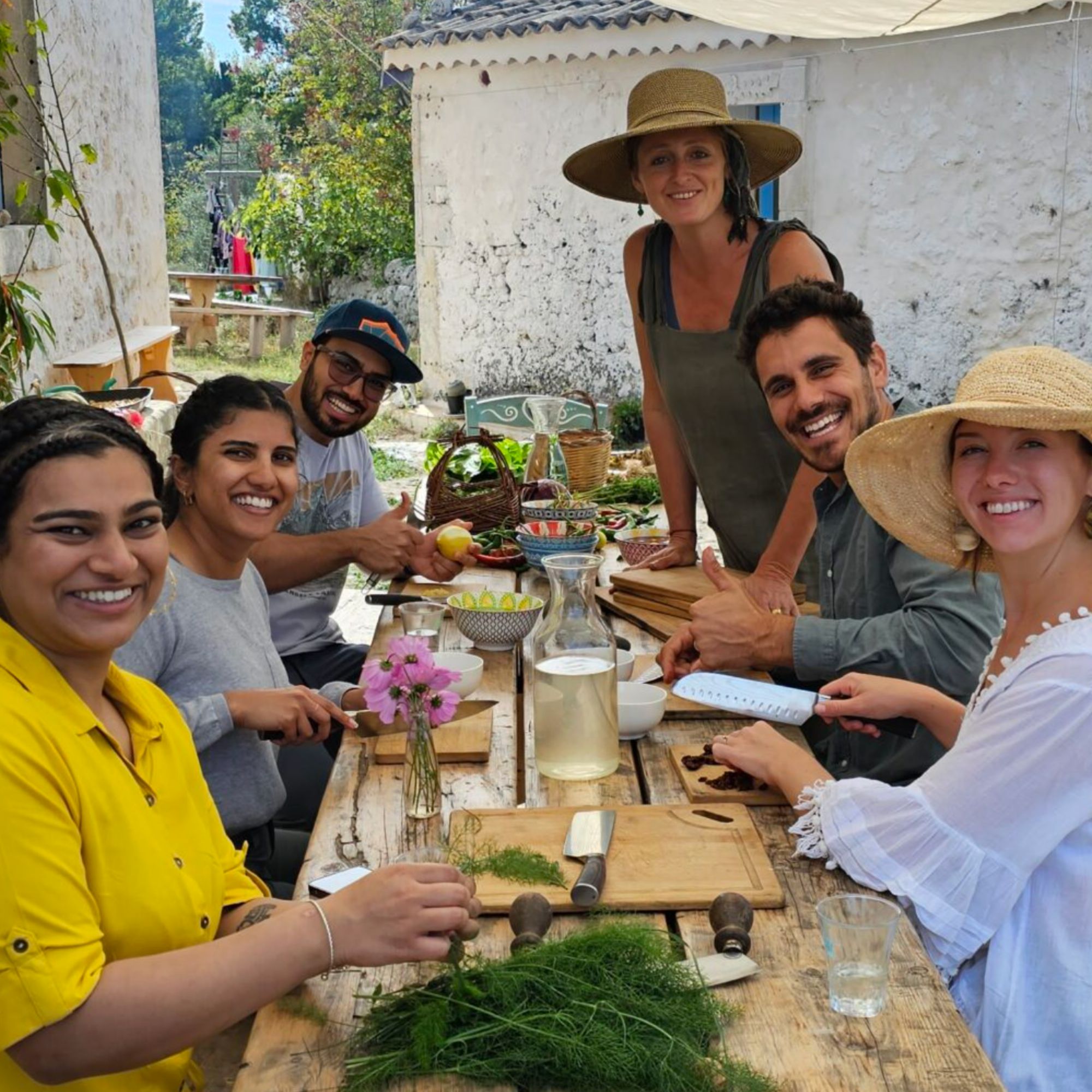 Guests preparing a Sicilian meal together at Slowlife Family Farm