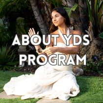 A woman in a white dress sits cross-legged on grass, holding a smudge stick with smoke rising, surrounded by lush green plants—invoking spiritual energy healing. Large text overlay reads, ABOUT YOUR DIVINE SELF PROGRAM.