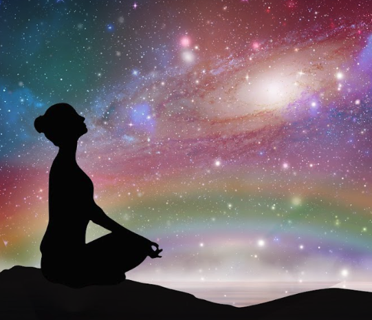 A silhouette of a person meditating on the ground beneath a vibrant galaxy, stars, and rainbow, representing Instincts, Intuition & Trusting Yourself (Group).