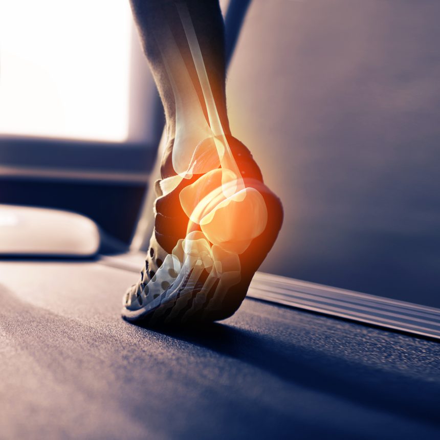 Close-up of a person’s foot in athletic shoes walking on a treadmill, with an illustration highlighting ankle pain—Movement As Medicine Classes support joint health and injury prevention.