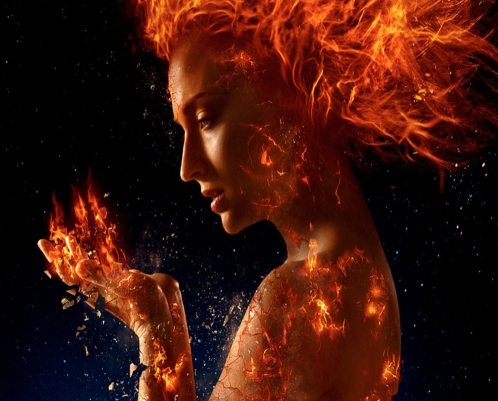 A woman with fiery hair and glowing cracks on her skin holds flames in her hand against a dark background, creating a powerful and mystical effect.