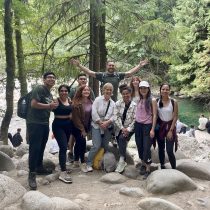 Adventure wellness life coach, Kevin Venn, is pictured hosting an outdoor team building workshop with an organizational team.