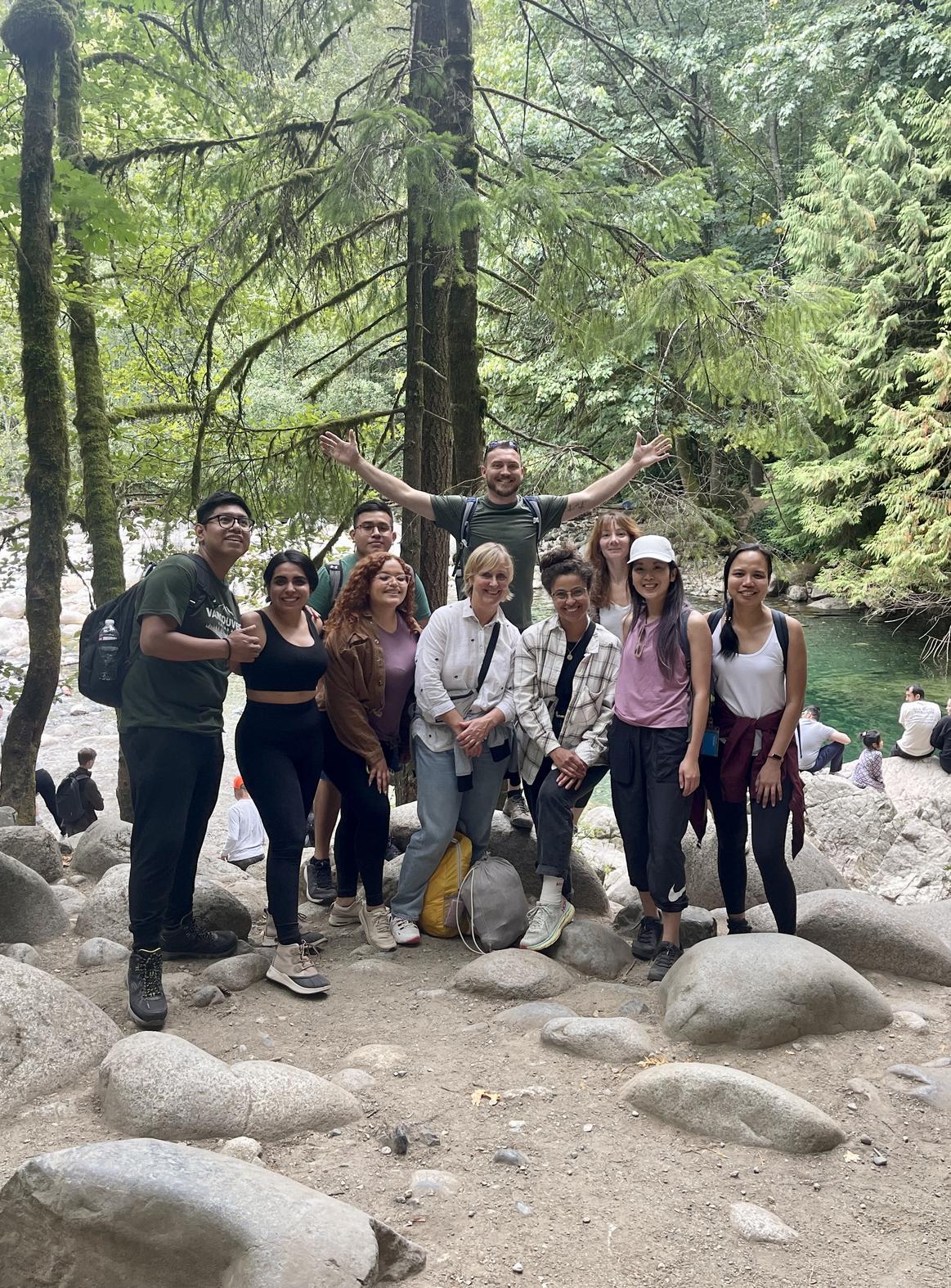 Adventure wellness life coach, Kevin Venn, is pictured hosting an outdoor team building workshop with an organizational team.
