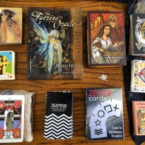 Various tarot and other intuitive reading decks laid out on display.