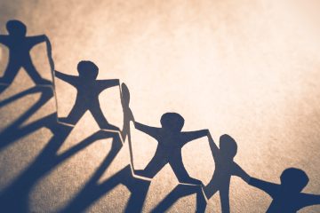 Shadow figures holding hands