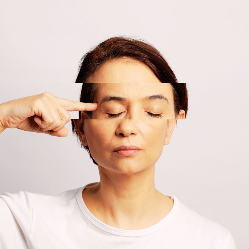 A woman in a white shirt with short brown hair and closed eyes points to her temple, her face artistically sliced, visually symbolizing the Fertility Activation Session and a transformative journey toward inner guidance.