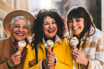 3 middle-aged women friends sharing an ice-cream