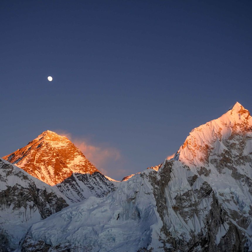 Mount Everest and surrounding Himalayan peaks at sunset in Nepal