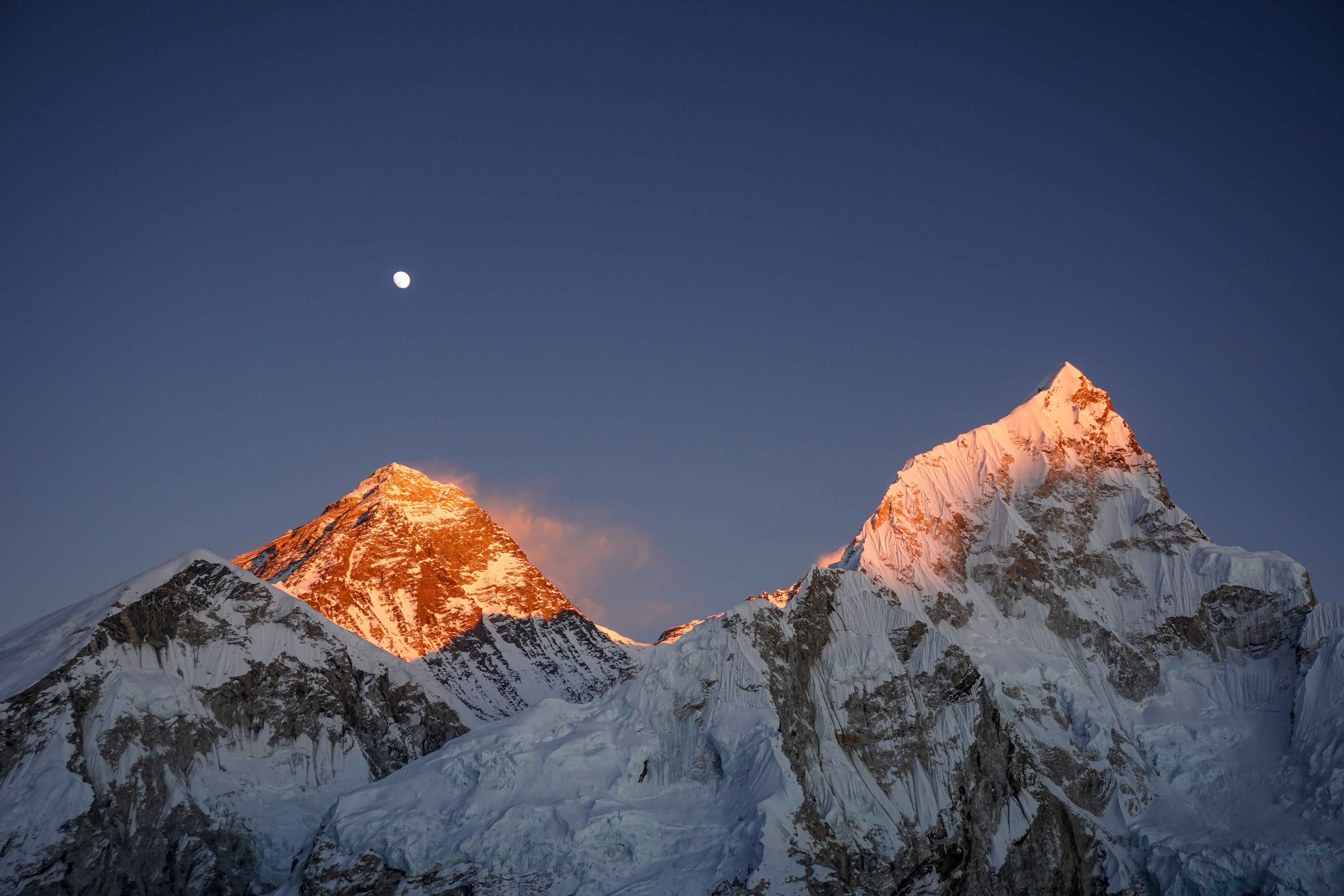 Mount Everest and surrounding Himalayan peaks at sunset in Nepal