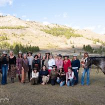 Women with horses at a Montana cowgirl yoga retreat