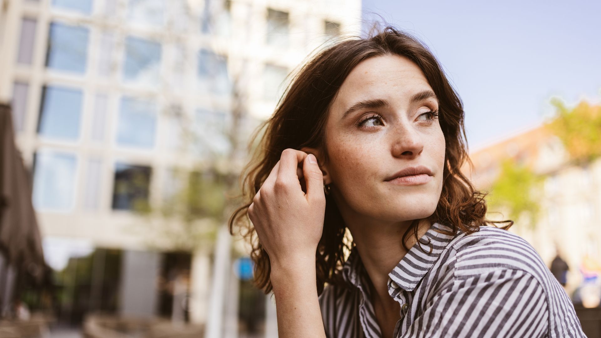 Thoughtful woman displaying the emotional sensitivity associated with empath traits