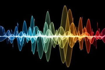 Colorful sound waves on a black background, with waveforms transitioning from blue on the left to red on the right, creating a vibrant visual representation of audio frequencies inspired by the solfeggio scale and highlighting the significance of the 528 Hz frequency.