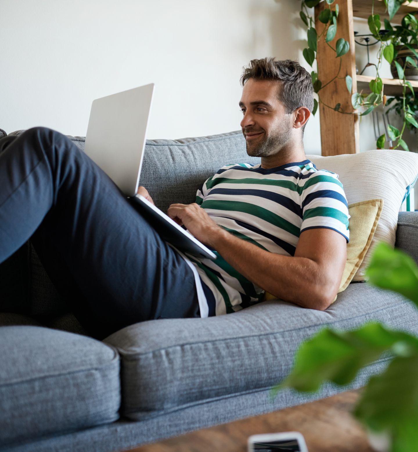 Man taking part in a private online coaching session from home.