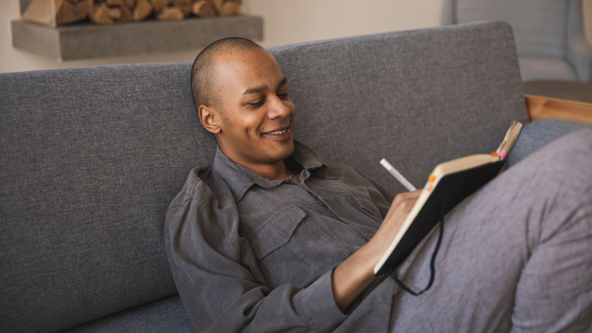 Man writing in a journal while practicing personal growth exercises