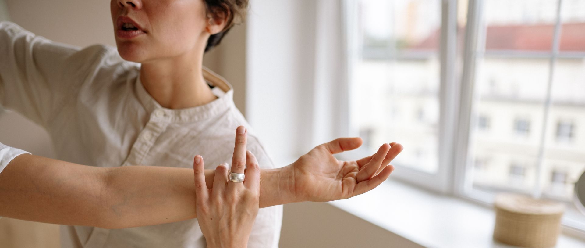 Woman practicing body awareness during a somatic coaching exercise